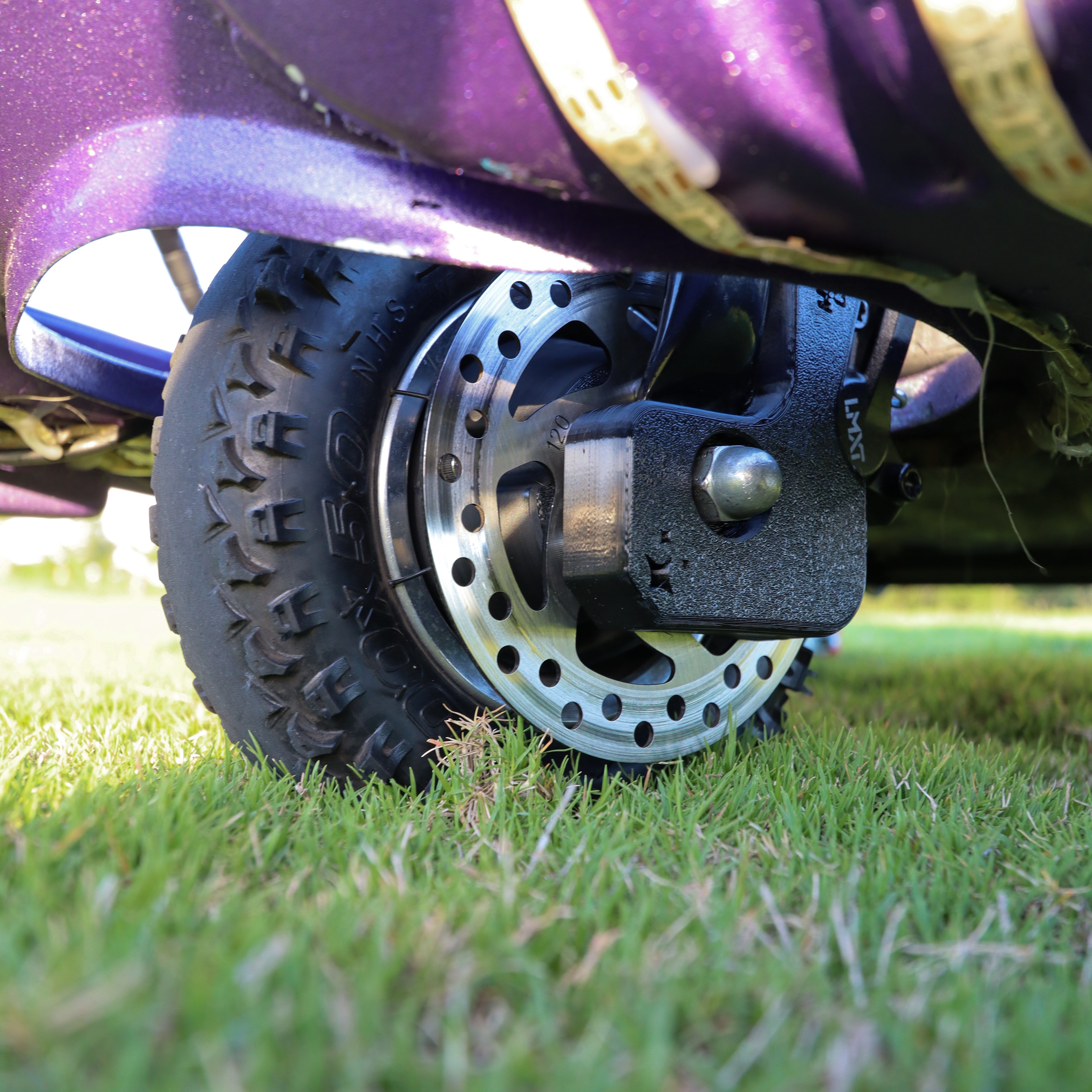 Close-up of Manji Cart disc brake system installed on crazy cart wheel.