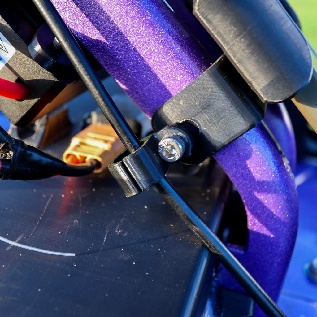 Close up of brake line mount installed with Manji Cart disc brake system.