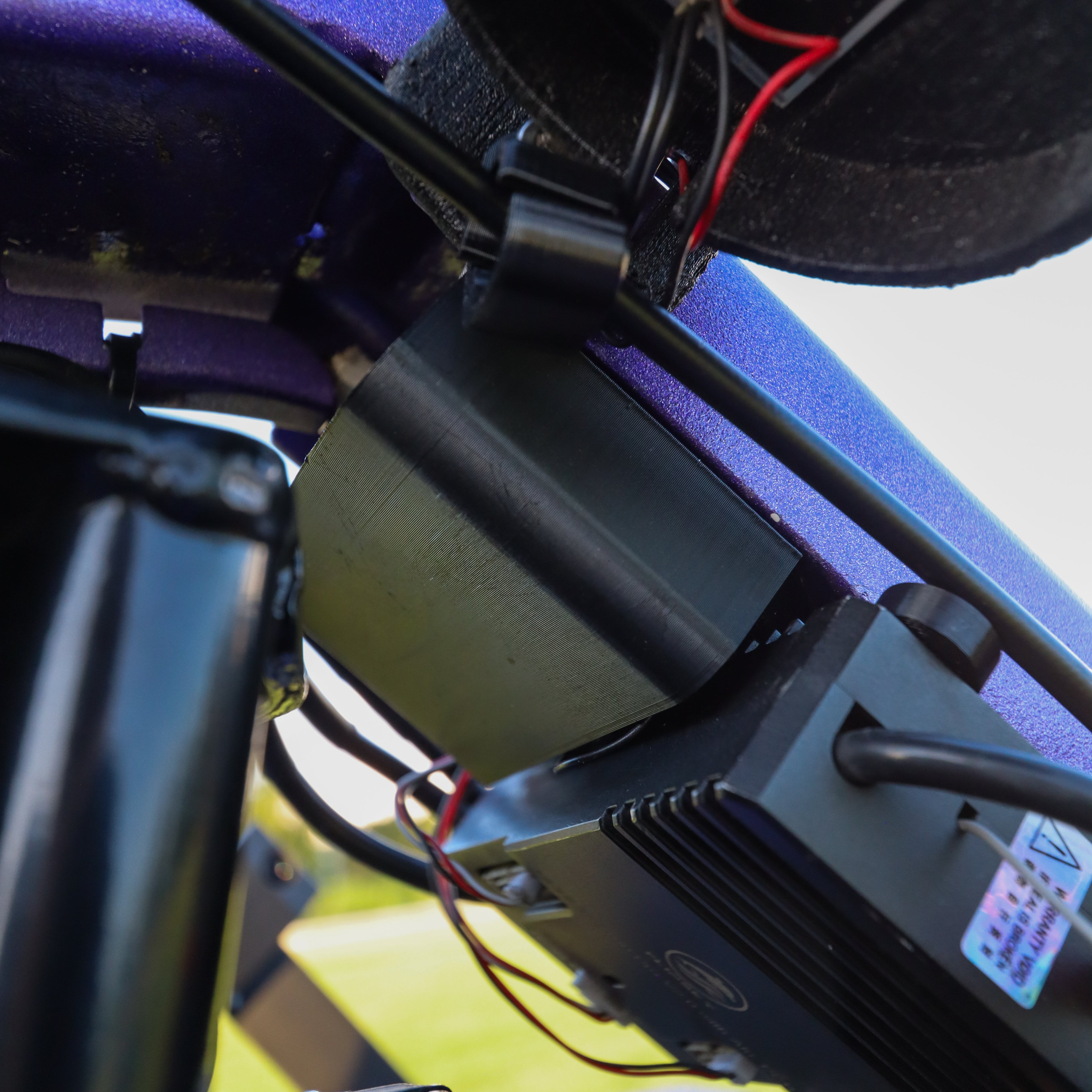 Close-up of wire cover assembly installed on crazy cart.