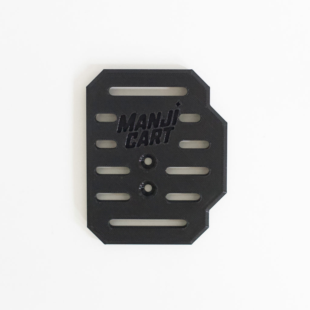 Close up of throttle pedal with Manji Cart branding.