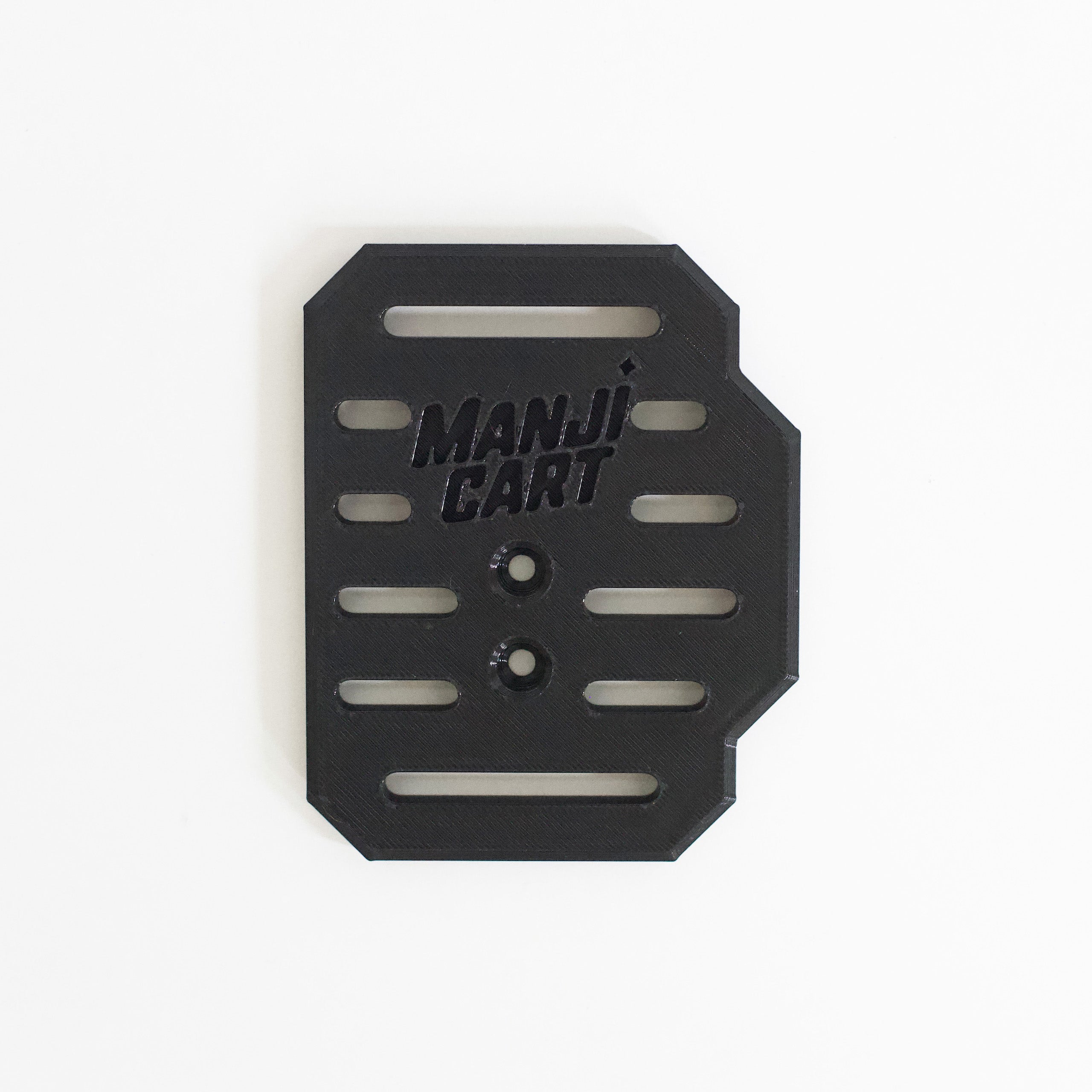 Close up of throttle pedal with Manji Cart branding.
